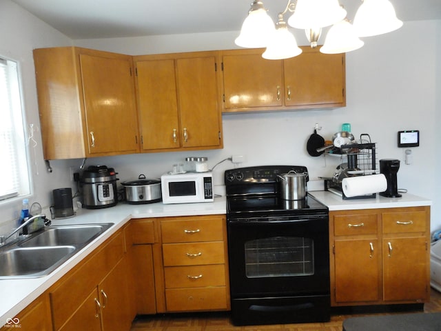 3426 Ireland Dr, Indianapolis, IN 46235 - kitchen with a sink, black electric range oven, white microwave, and light countertops