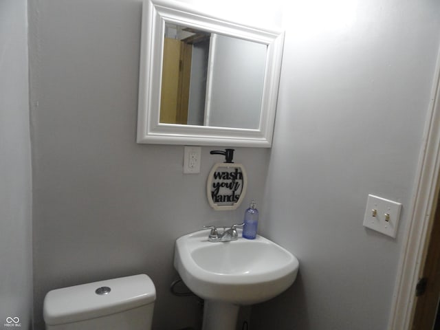 3426 Ireland Dr, Indianapolis, IN 46235 - half bathroom with a sink and toilet