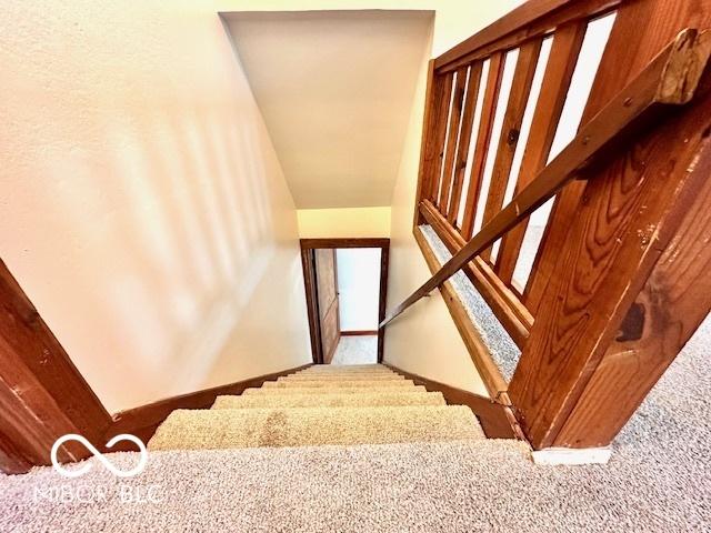 1045 13th St, Tell City, IN 47586 - stairway with carpet flooring
