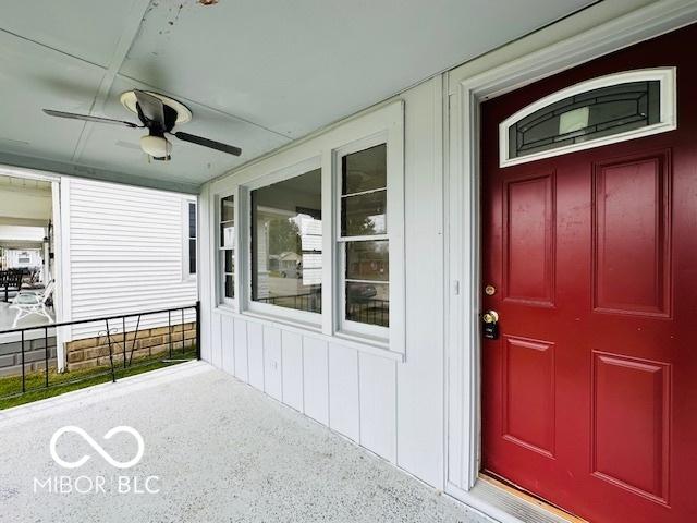 1045 13th St, Tell City, IN 47586 - view of exterior entry with ceiling fan and a porch