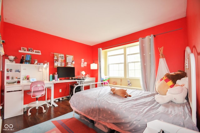 bedroom with wood finished floors