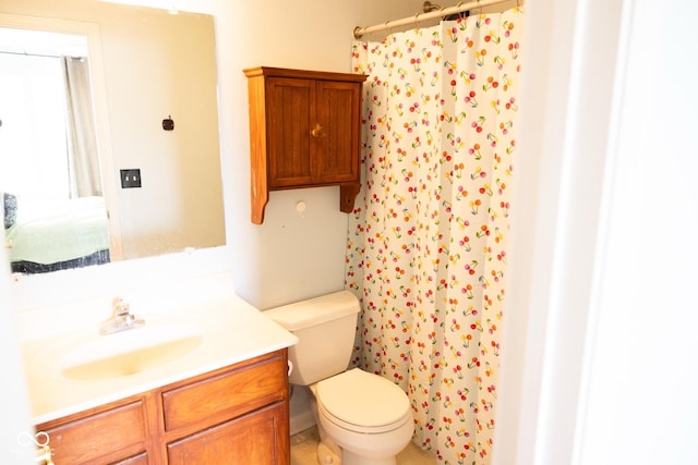 bathroom featuring vanity, a shower with curtain, and toilet