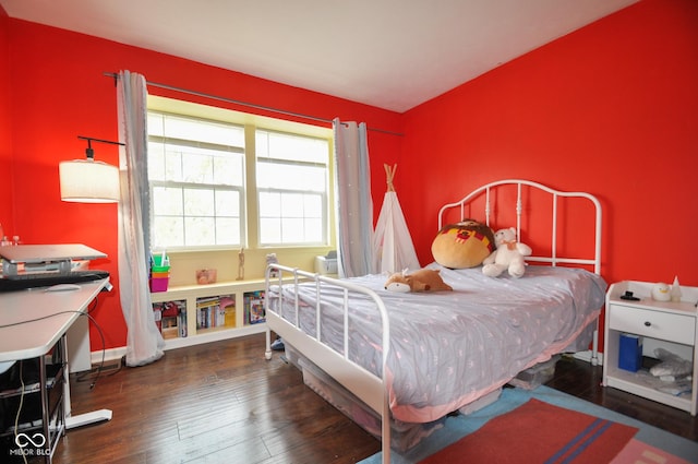 bedroom featuring hardwood / wood-style floors