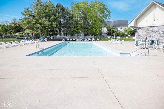 9718 Jupiter Pass, Carmel, IN 46032 - community pool with a patio and fence