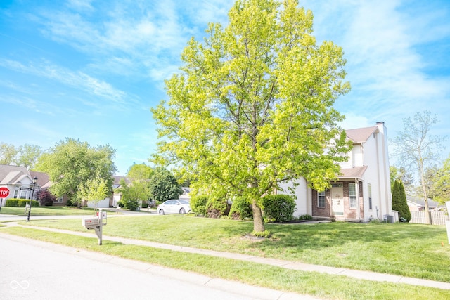 9718 Jupiter Pass, Carmel, IN 46032 - view of front of property featuring a front lawn, a chimney, and brick siding