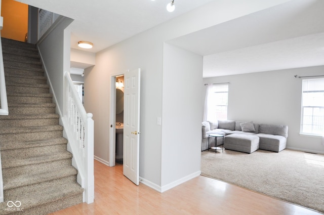 9718 Jupiter Pass, Carmel, IN 46032 - stairs with wood finished floors and baseboards