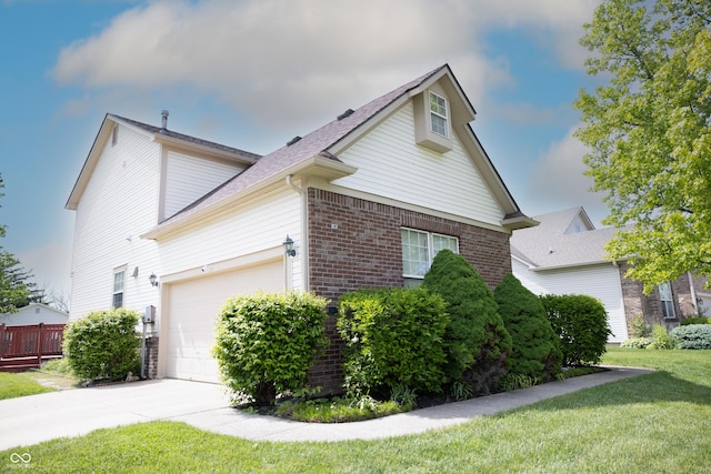9718 Jupiter Pass, Carmel, IN 46032 - view of property exterior with brick siding, an attached garage, driveway, a lawn, and roof with shingles