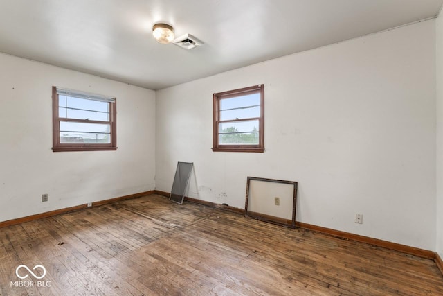 3200 Raible Ave, Anderson, IN 46011 - empty room featuring baseboards, a wealth of natural light, and hardwood / wood-style flooring