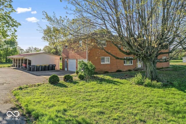 3200 Raible Ave, Anderson, IN 46011 - view of home's exterior featuring a yard and aphalt driveway