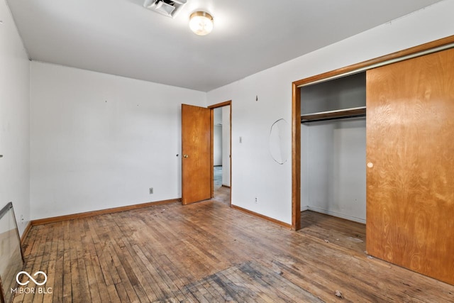 3200 Raible Ave, Anderson, IN 46011 - unfurnished bedroom with a closet, visible vents, baseboards, and hardwood / wood-style floors