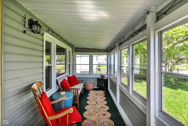 sunroom / solarium featuring a healthy amount of sunlight