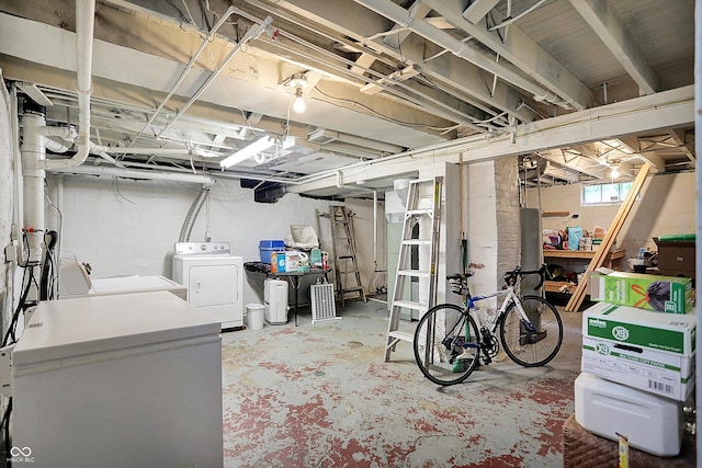 below grade area featuring independent washer and dryer and fridge