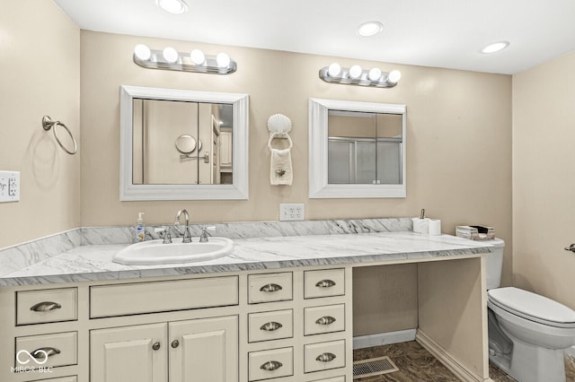 315 W High St, Pendleton, IN 46064 - bathroom featuring toilet, vanity, marble finish floors, and recessed lighting