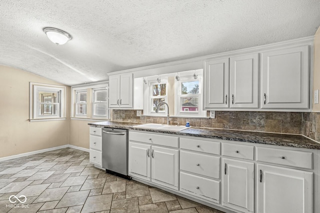 315 W High St, Pendleton, IN 46064 - kitchen with a sink, stainless steel dishwasher, baseboards, backsplash, and lofted ceiling