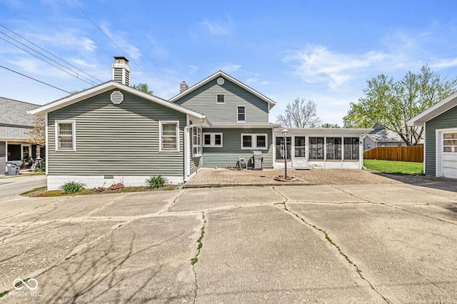 315 W High St, Pendleton, IN 46064 - rear view of property featuring a sunroom, fence, a chimney, and crawl space