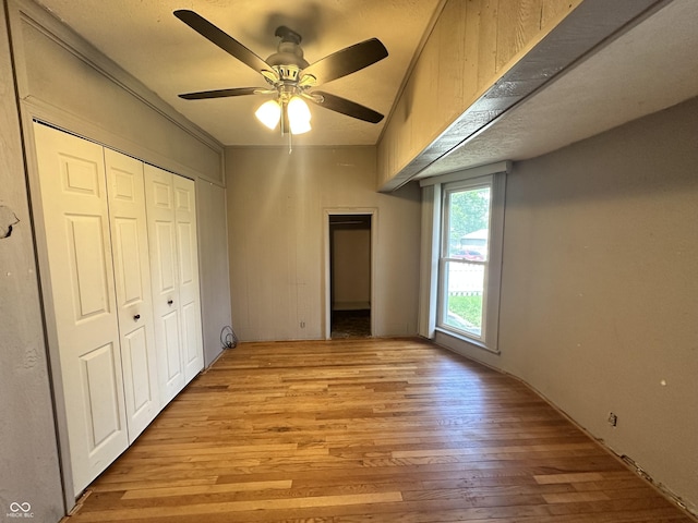 315 W High St, Pendleton, IN 46064 - unfurnished bedroom with light wood finished floors, a closet, and ceiling fan