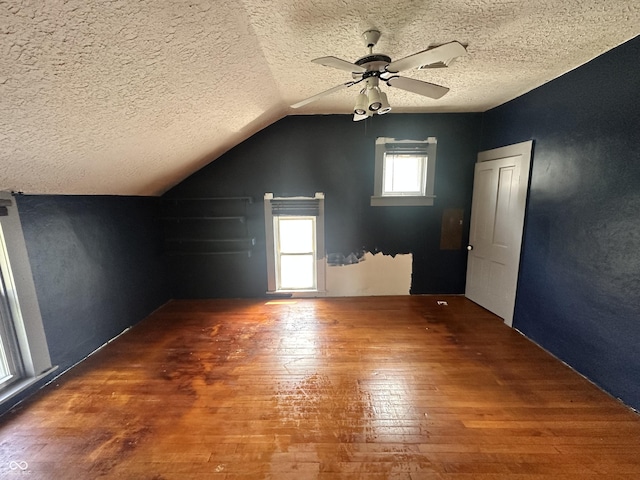 315 W High St, Pendleton, IN 46064 - additional living space with wood-type flooring, a ceiling fan, a textured ceiling, and lofted ceiling