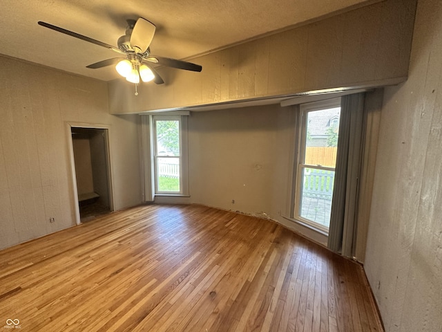 315 W High St, Pendleton, IN 46064 - unfurnished room featuring hardwood / wood-style floors, plenty of natural light, and a ceiling fan