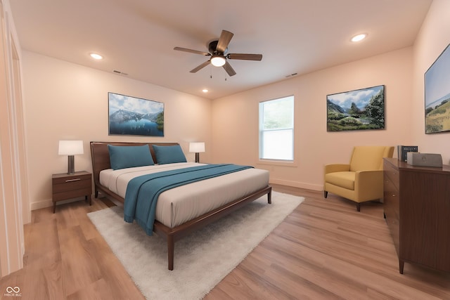 bedroom featuring baseboards, light wood-type flooring, and visible vents