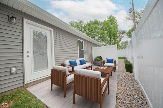 view of patio featuring fence and outdoor lounge area