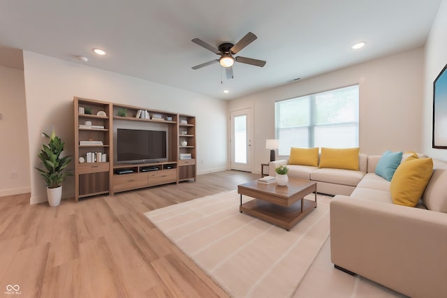 living room featuring recessed lighting, baseboards, ceiling fan, and light wood-type flooring