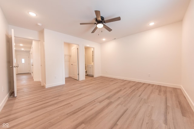 unfurnished bedroom with baseboards, light wood-style flooring, and recessed lighting