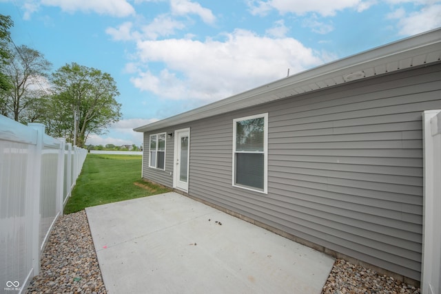 view of patio / terrace featuring fence