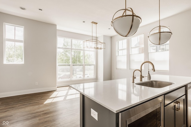 401 Jersey St, Westfield, IN 46074 - kitchen featuring baseboards, stainless steel microwave, a wealth of natural light, and a sink