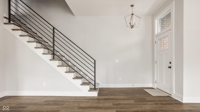 401 Jersey St, Westfield, IN 46074 - entryway featuring an inviting chandelier, baseboards, stairs, and wood finished floors