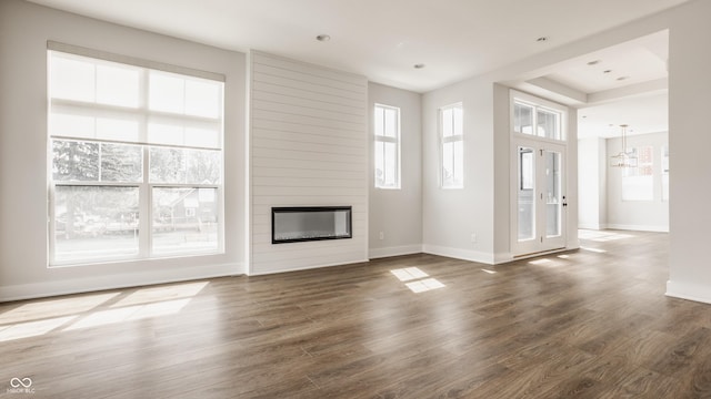401 Jersey St, Westfield, IN 46074 - unfurnished living room with baseboards, dark wood-style floors, and a fireplace
