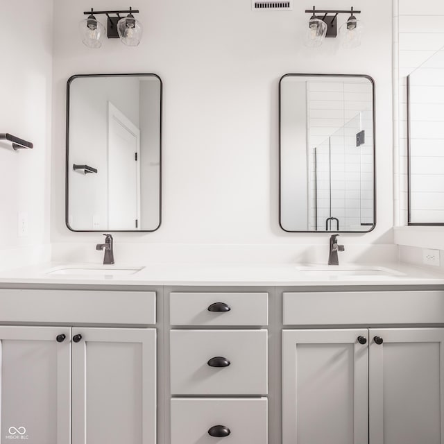 401 Jersey St, Westfield, IN 46074 - bathroom featuring double vanity, a sink, and visible vents