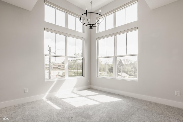 401 Jersey St, Westfield, IN 46074 - spare room featuring baseboards, carpet floors, and a chandelier
