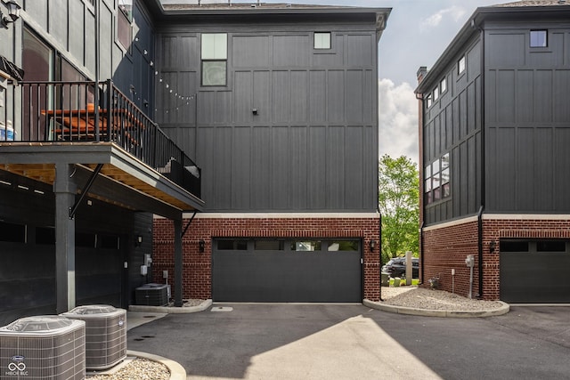 401 Jersey St, Westfield, IN 46074 - view of building exterior featuring an attached garage, cooling unit, and driveway