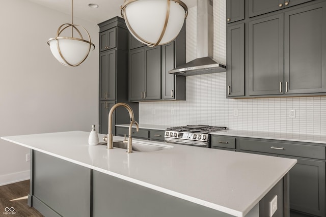 401 Jersey St, Westfield, IN 46074 - kitchen with wall chimney range hood, gray cabinets, a sink, and stainless steel gas range