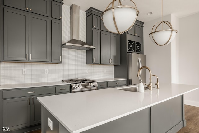 401 Jersey St, Westfield, IN 46074 - kitchen with appliances with stainless steel finishes, a sink, decorative backsplash, wall chimney range hood, and an island with sink