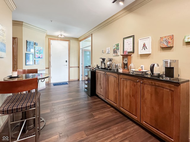 1026 Jackson St, Columbus, IN 47201 - foyer featuring dark wood-style floors and ornamental molding