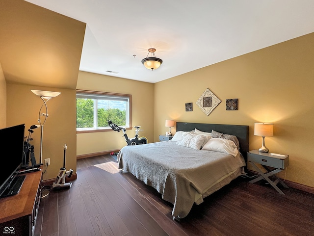 1026 Jackson St, Columbus, IN 47201 - bedroom with baseboards and dark wood-style flooring