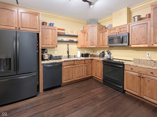 1026 Jackson St, Columbus, IN 47201 - kitchen featuring stainless steel appliances, a sink, light stone countertops, dark wood-style floors, and crown molding