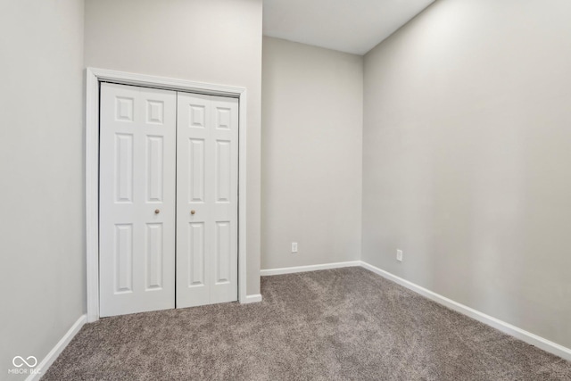 202 Mckim Ave, Indianapolis, IN 46201 - unfurnished bedroom with carpet floors, baseboards, and a closet