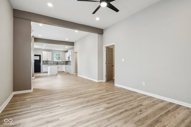 202 Mckim Ave, Indianapolis, IN 46201 - unfurnished living room featuring light wood finished floors, baseboards, ceiling fan, and recessed lighting