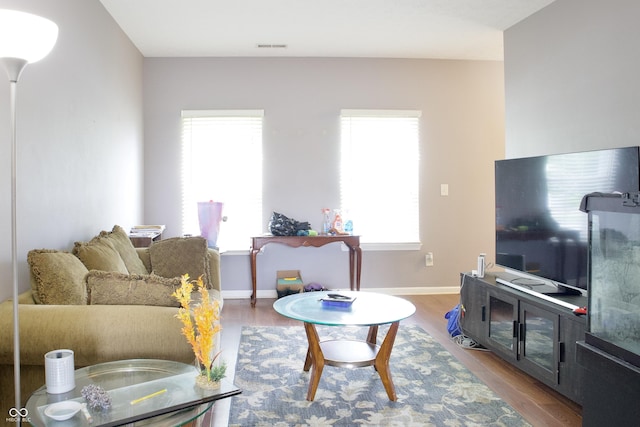 1831 Brook Crossing Way, Indianapolis, IN 46229 - living area featuring visible vents, baseboards, and wood finished floors