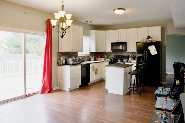 1831 Brook Crossing Way, Indianapolis, IN 46229 - kitchen with a wealth of natural light, black appliances, and tasteful backsplash