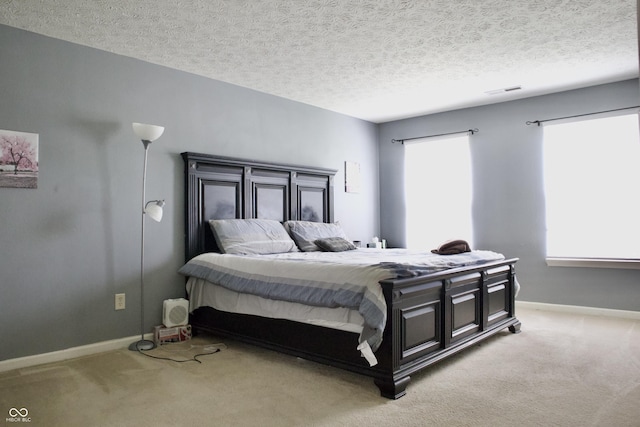 1831 Brook Crossing Way, Indianapolis, IN 46229 - bedroom with baseboards, a textured ceiling, and light carpet