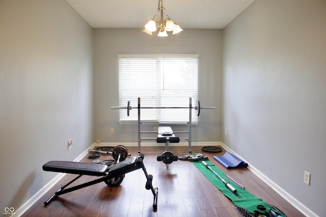 1831 Brook Crossing Way, Indianapolis, IN 46229 - workout area featuring baseboards, an inviting chandelier, and wood finished floors