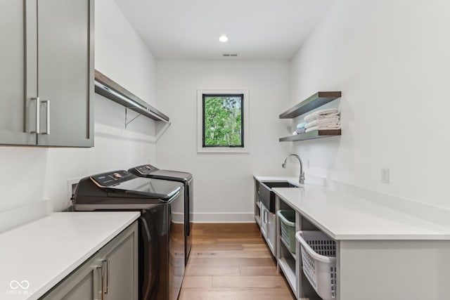 11064 Hamilton Run, Zionsville, IN 46077 - clothes washing area with cabinet space, separate washer and dryer, wood-type flooring, baseboards, and recessed lighting