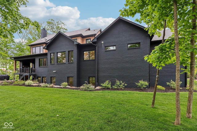 11064 Hamilton Run, Zionsville, IN 46077 - view of side of home featuring a chimney, a yard, and brick siding