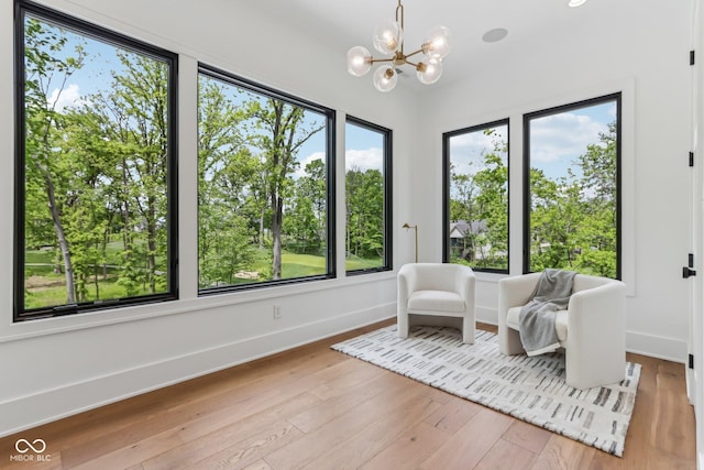 11064 Hamilton Run, Zionsville, IN 46077 - sitting room featuring baseboards, wood-type flooring, and a chandelier