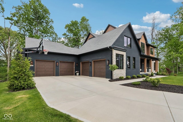 11064 Hamilton Run, Zionsville, IN 46077 - view of front of home with an attached garage, concrete driveway, a front lawn, and roof with shingles