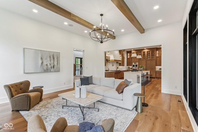 11064 Hamilton Run, Zionsville, IN 46077 - living room featuring beam ceiling, light wood-type flooring, a chandelier, recessed lighting, and baseboards