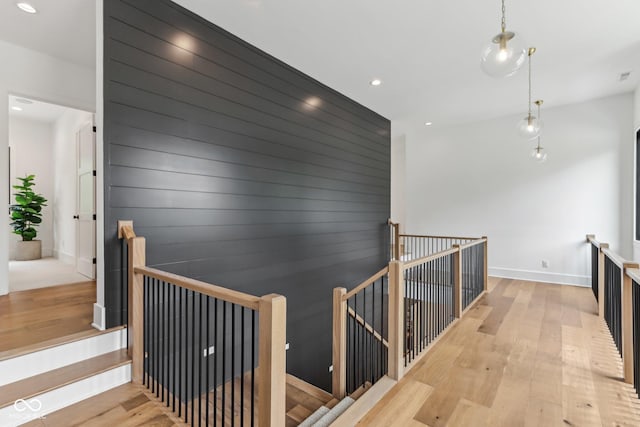 11064 Hamilton Run, Zionsville, IN 46077 - hallway featuring an upstairs landing, wood-type flooring, recessed lighting, and baseboards